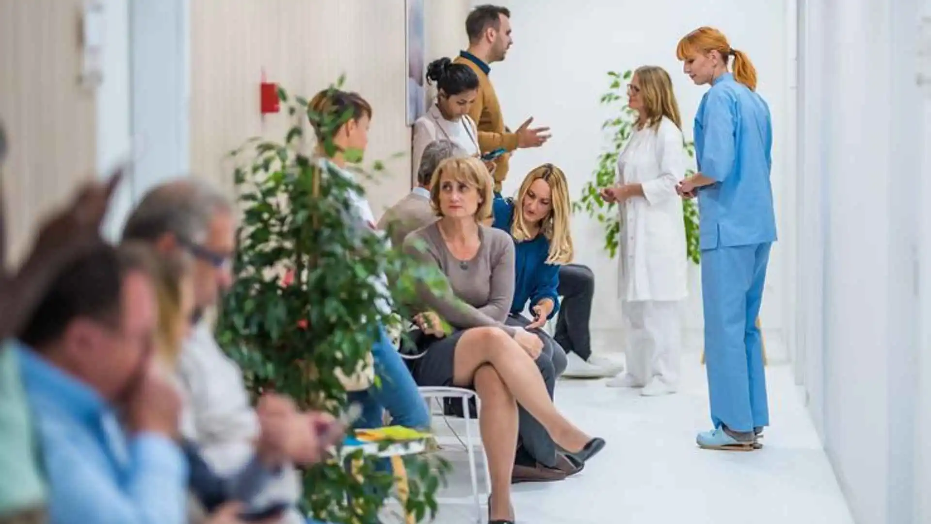 patients waiting to be seen in a waiting area